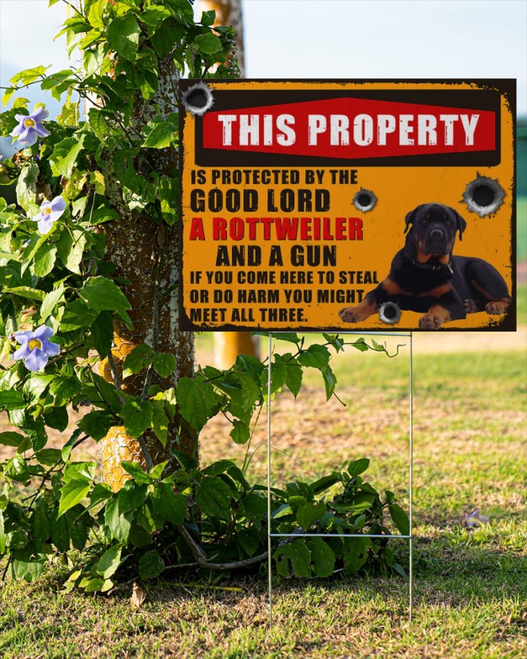 Rottweiler This property is protected by good lord a Rottweiler and a gun yard sign 14