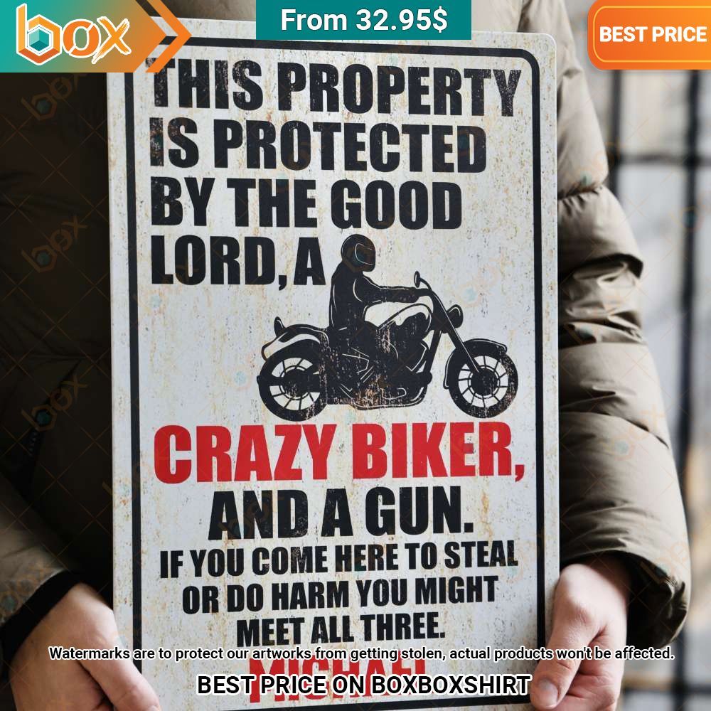 this property is protected by the good lord a crazy biker and a gun metal sign 2 769.jpg